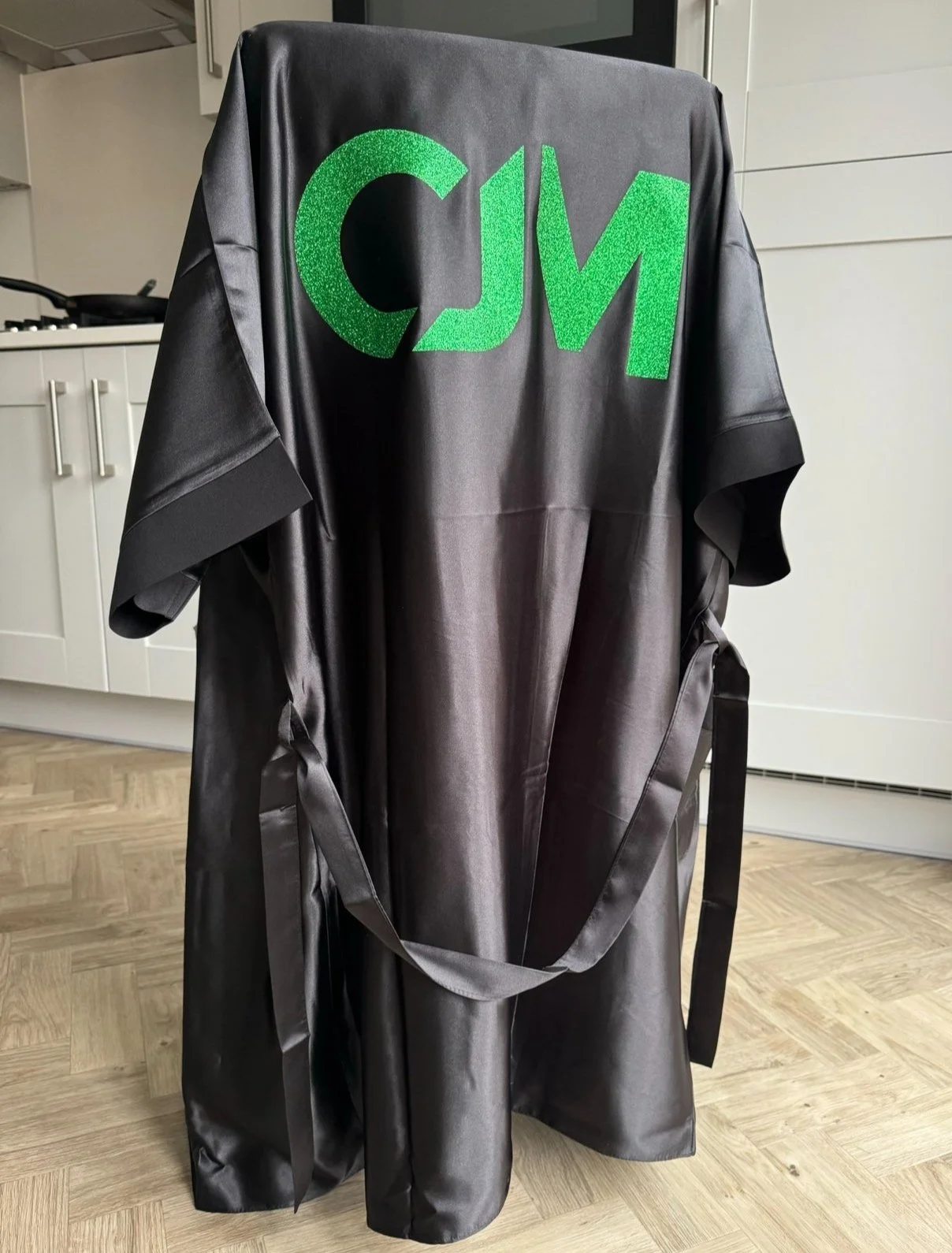 CJM Competition Robe, back view with green CJM logo