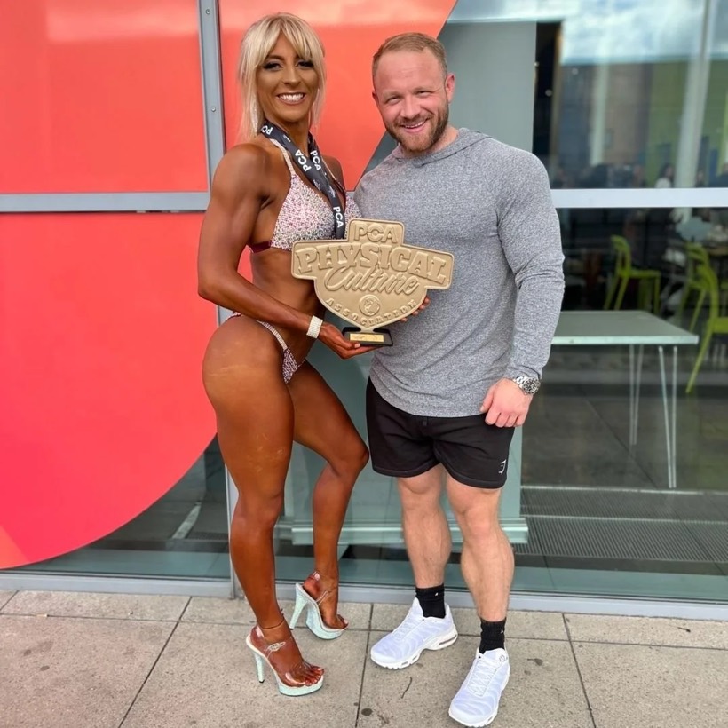 Team CJM Men's Physique competitor on stage